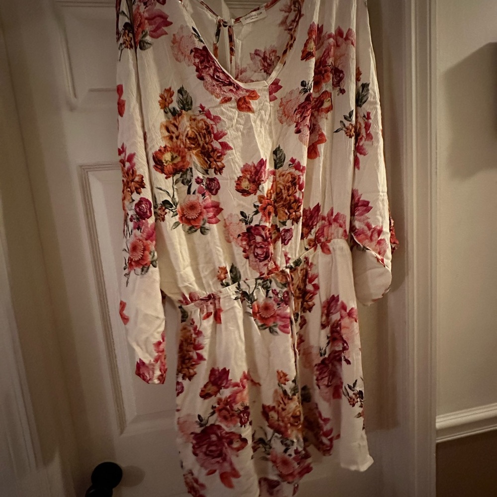 Romper new never worn. Slightly oversized. Very giving in the bust area.